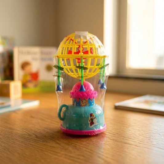 WIND-UP MUSICAL ROTATING TOY FOR TODDLERS